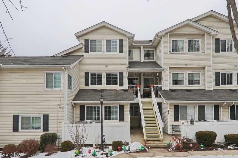 a front view of a house with glass windows