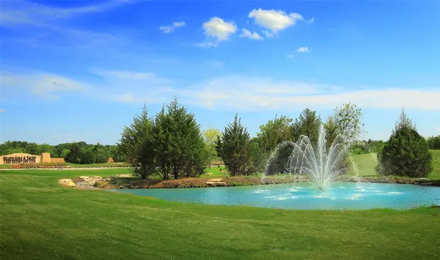 a view of a lake with a yard