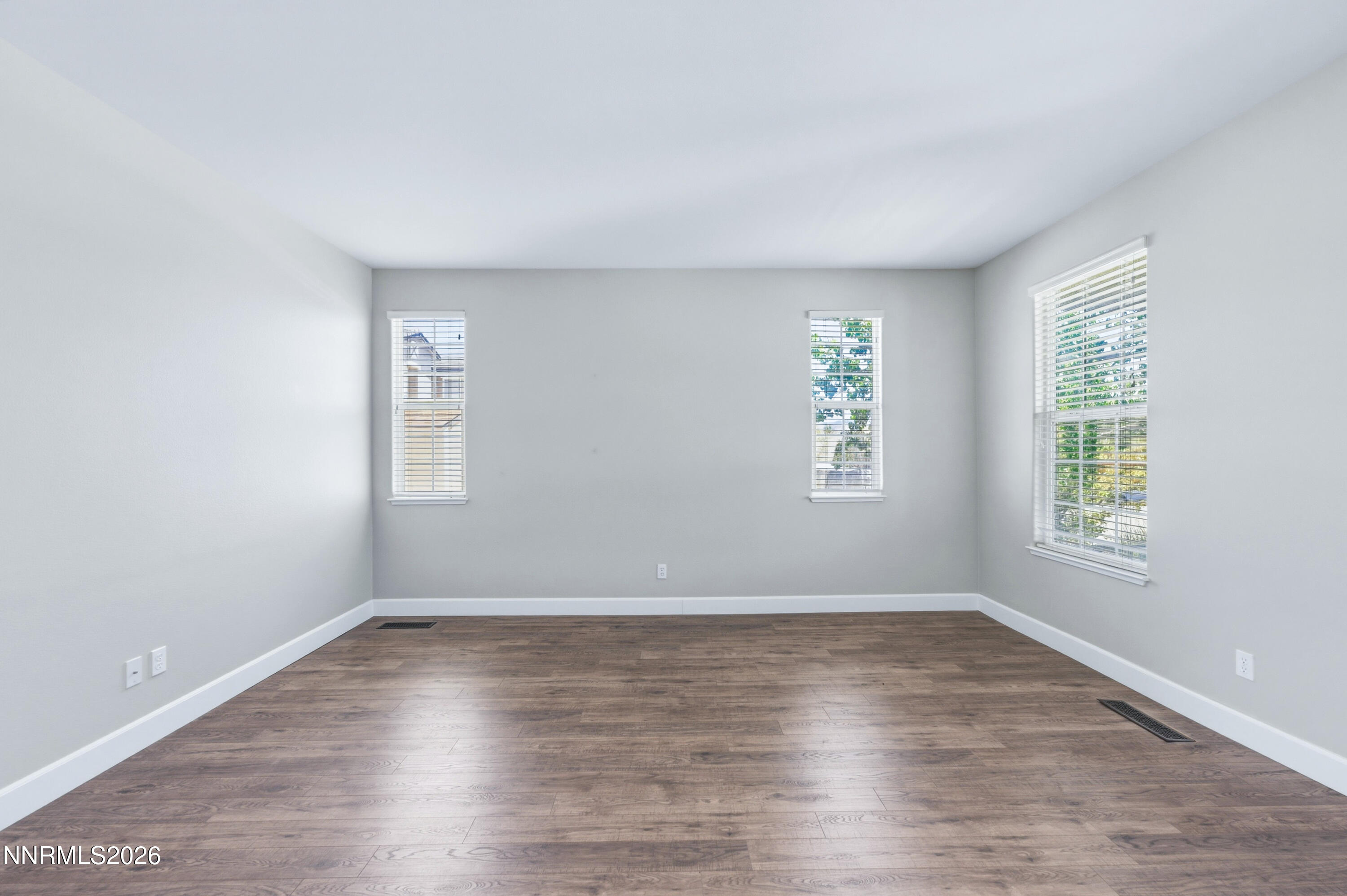 1770 Kodiak Circle Reno, NV 89511 - Photo 4 of 32 an empty room with wooden floor and windows
