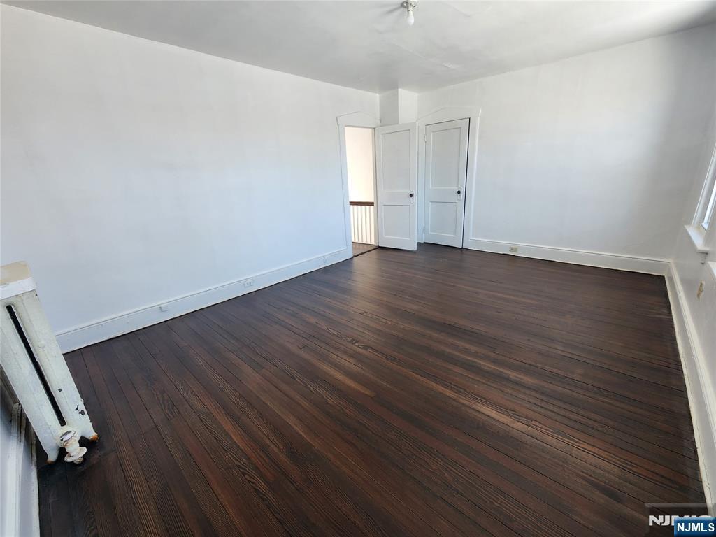 752 Ridge Road Lyndhurst, NJ 07071 - Photo 13 of 19 wooden floor in an empty room