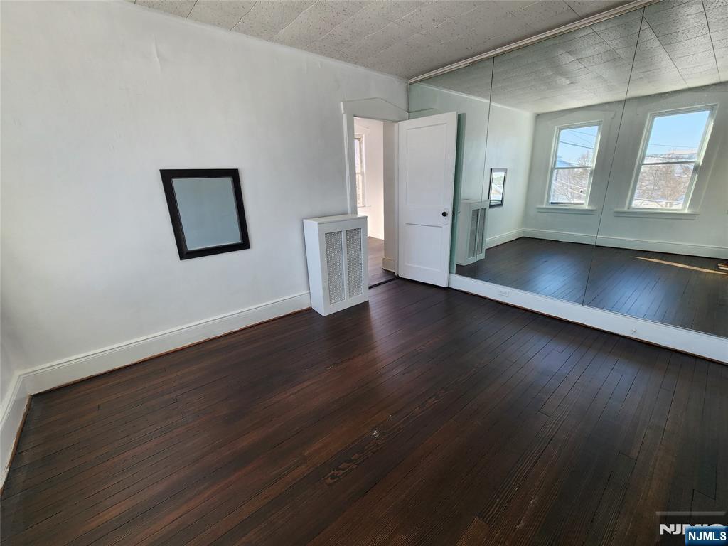 752 Ridge Road Lyndhurst, NJ 07071 - Photo 14 of 19 a view of an empty room with wooden floor and a window