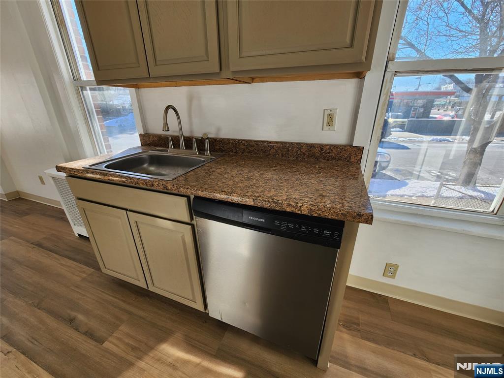 752 Ridge Road Lyndhurst, NJ 07071 - Photo 19 of 19 a kitchen with granite countertop a sink and a stove next to a window