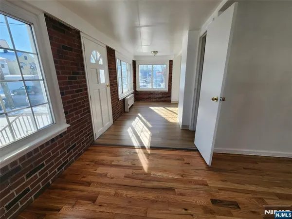 a view of entryway with wooden floor