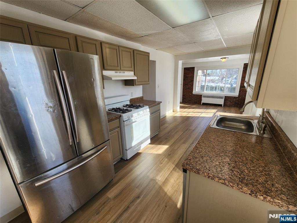 752 Ridge Road Lyndhurst, NJ 07071 - Photo 8 of 19 a kitchen with stainless steel appliances granite countertop a refrigerator stove top oven and sink