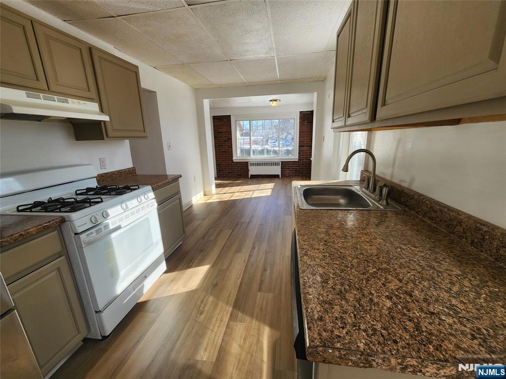 752 Ridge Road Lyndhurst, NJ 07071 - Photo 9 of 19 a kitchen with granite countertop a sink stainless steel appliances and cabinets
