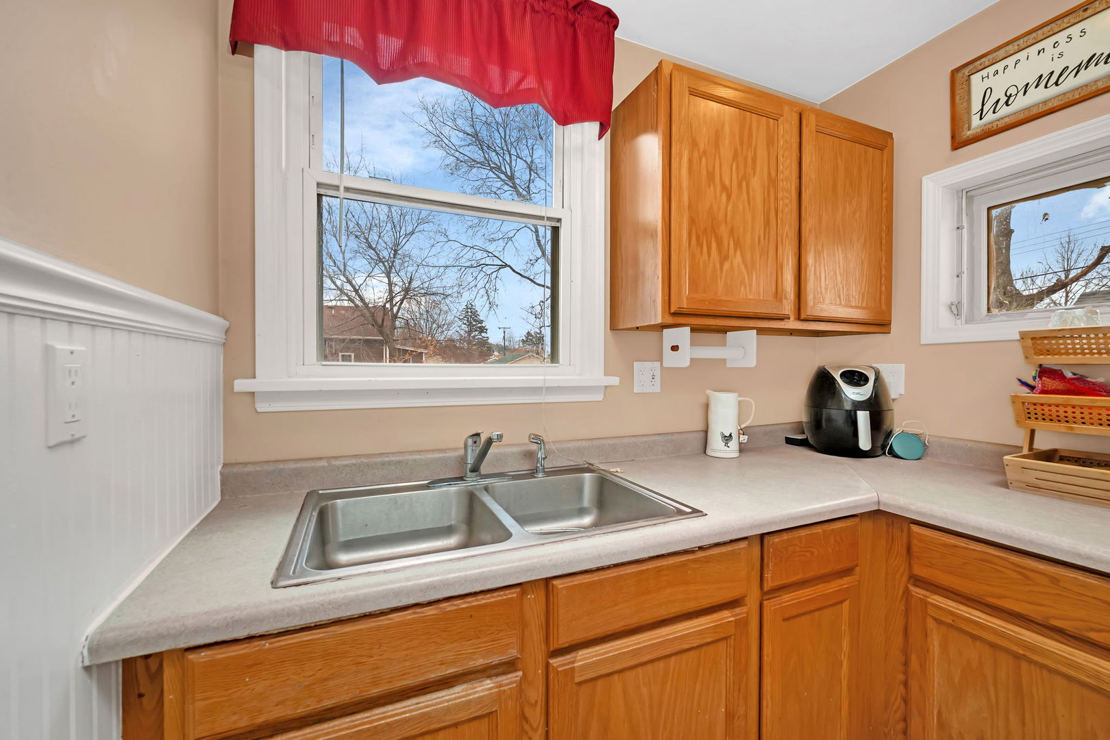 565 East Norris Drive Ottawa, IL 61350 - Photo 12 of 42 a kitchen with stainless steel appliances granite countertop a sink window and cabinets