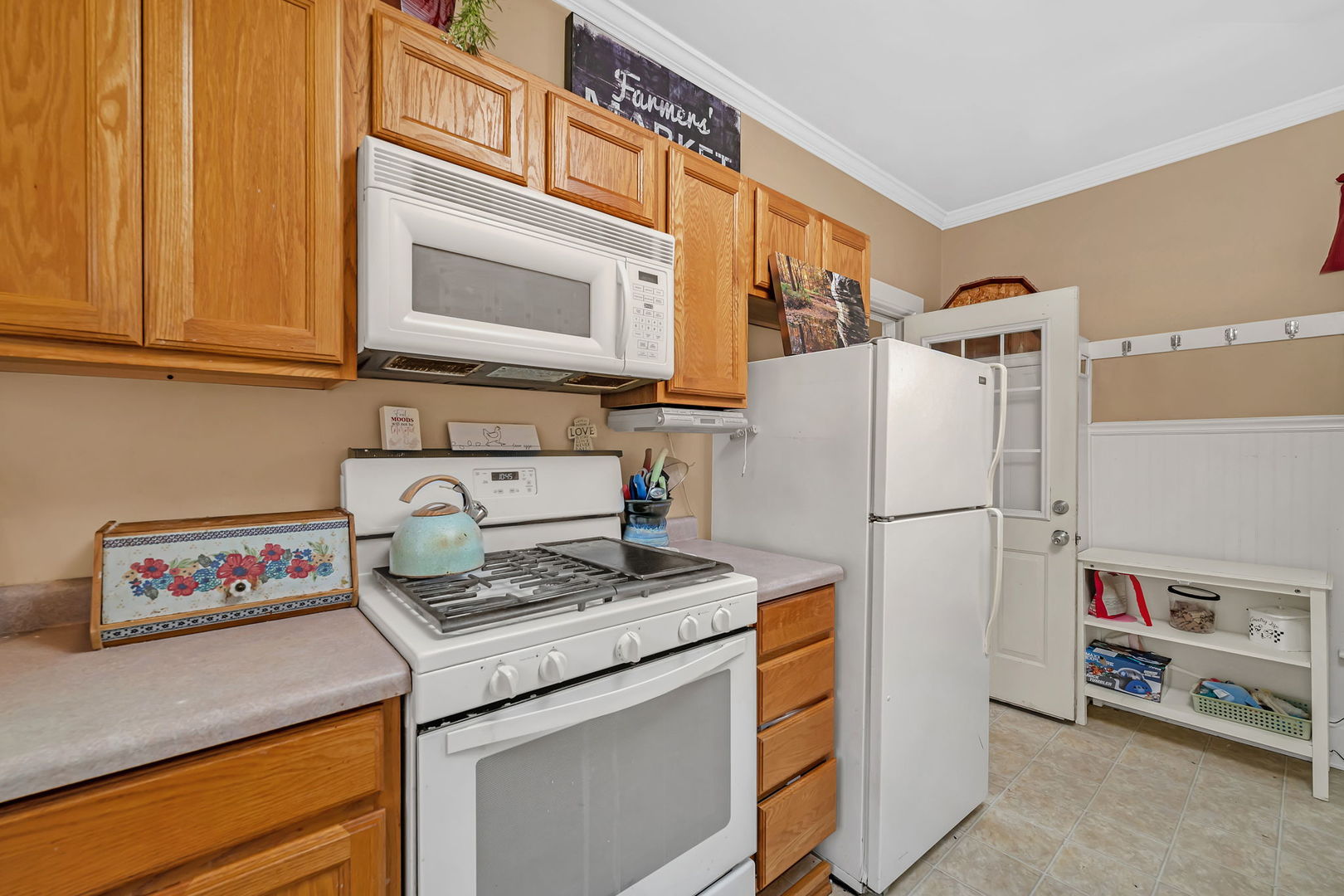 565 East Norris Drive Ottawa, IL 61350 - Photo 13 of 42 a kitchen with refrigerator and cabinets
