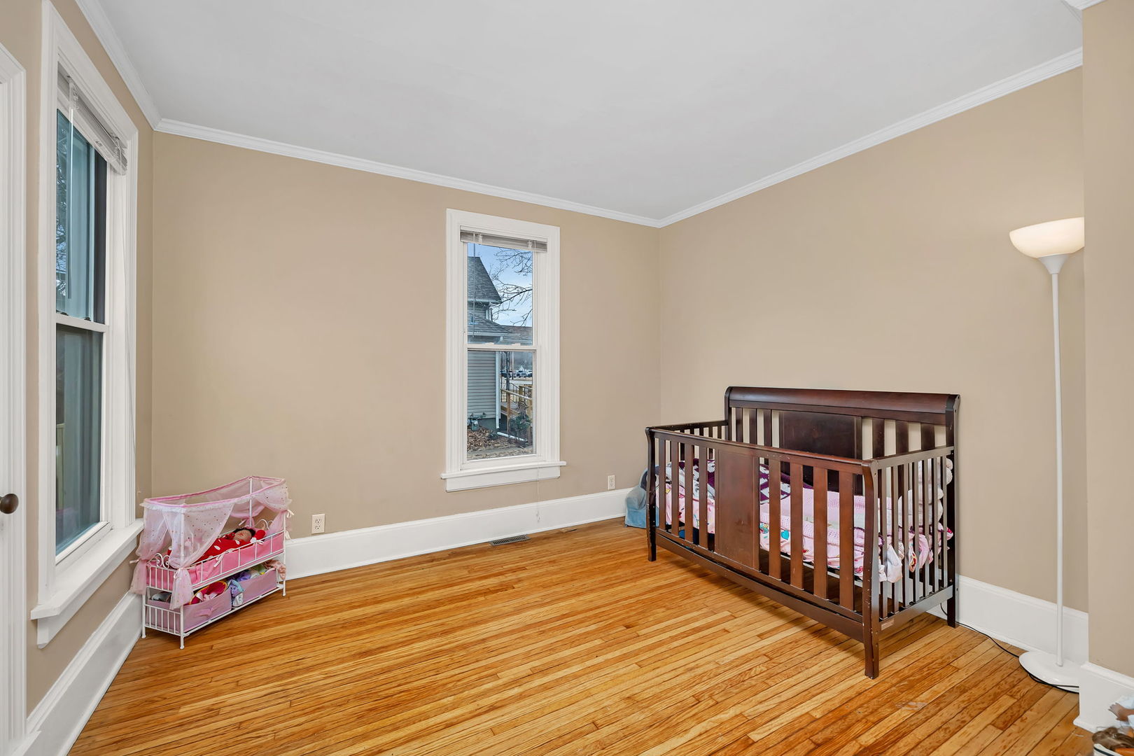 565 East Norris Drive Ottawa, IL 61350 - Photo 16 of 42 a bedroom with a bed and wooden floor