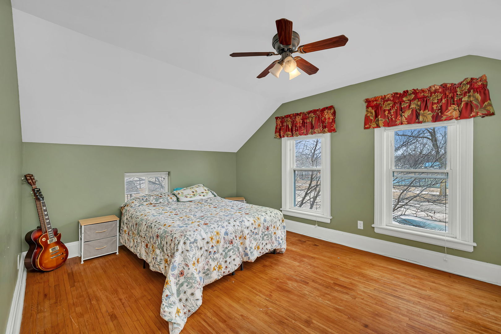 565 East Norris Drive Ottawa, IL 61350 - Photo 18 of 42 a bedroom with a bed and a chandelier