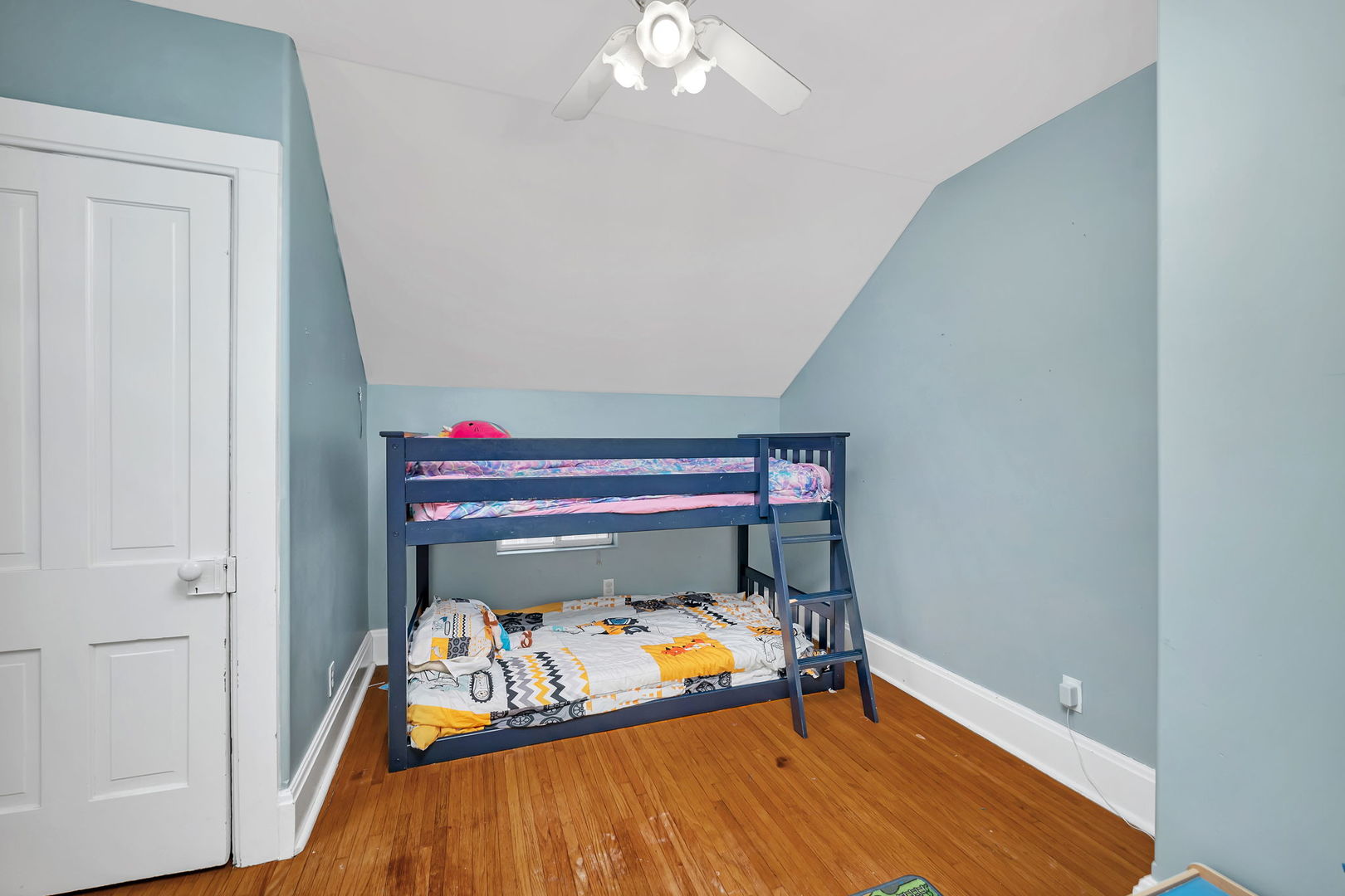 565 East Norris Drive Ottawa, IL 61350 - Photo 20 of 42 a bedroom with a bed and a chandelier