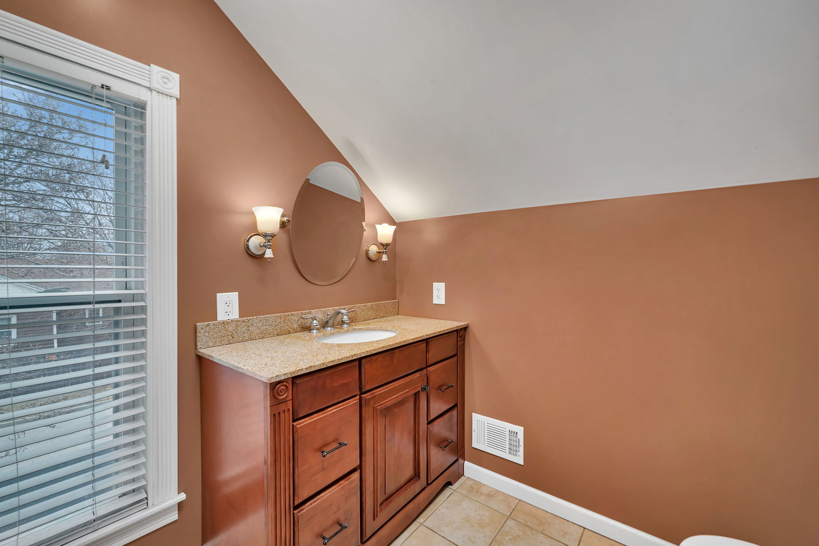 565 East Norris Drive Ottawa, IL 61350 - Photo 21 of 42 a bathroom with a sink a vanity and a mirror
