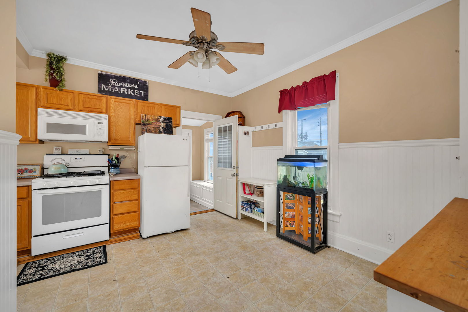 565 East Norris Drive Ottawa, IL 61350 - Photo 9 of 42 a kitchen with refrigerator and cabinets