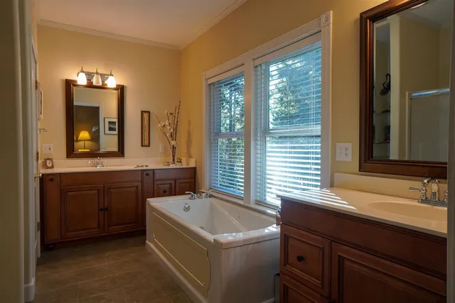 a en suite bathroom with a sink and a mirror