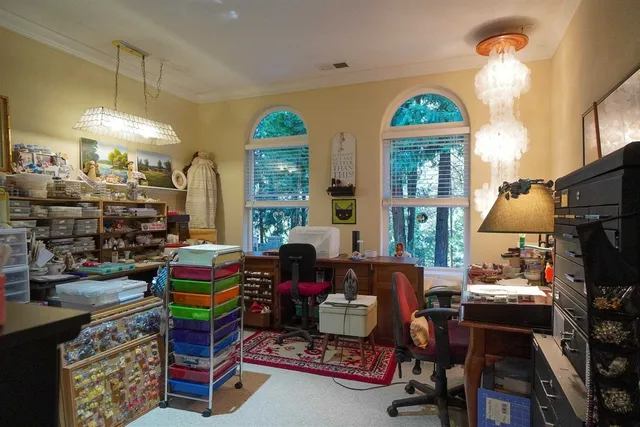 a view of a porch with chairs and backyard