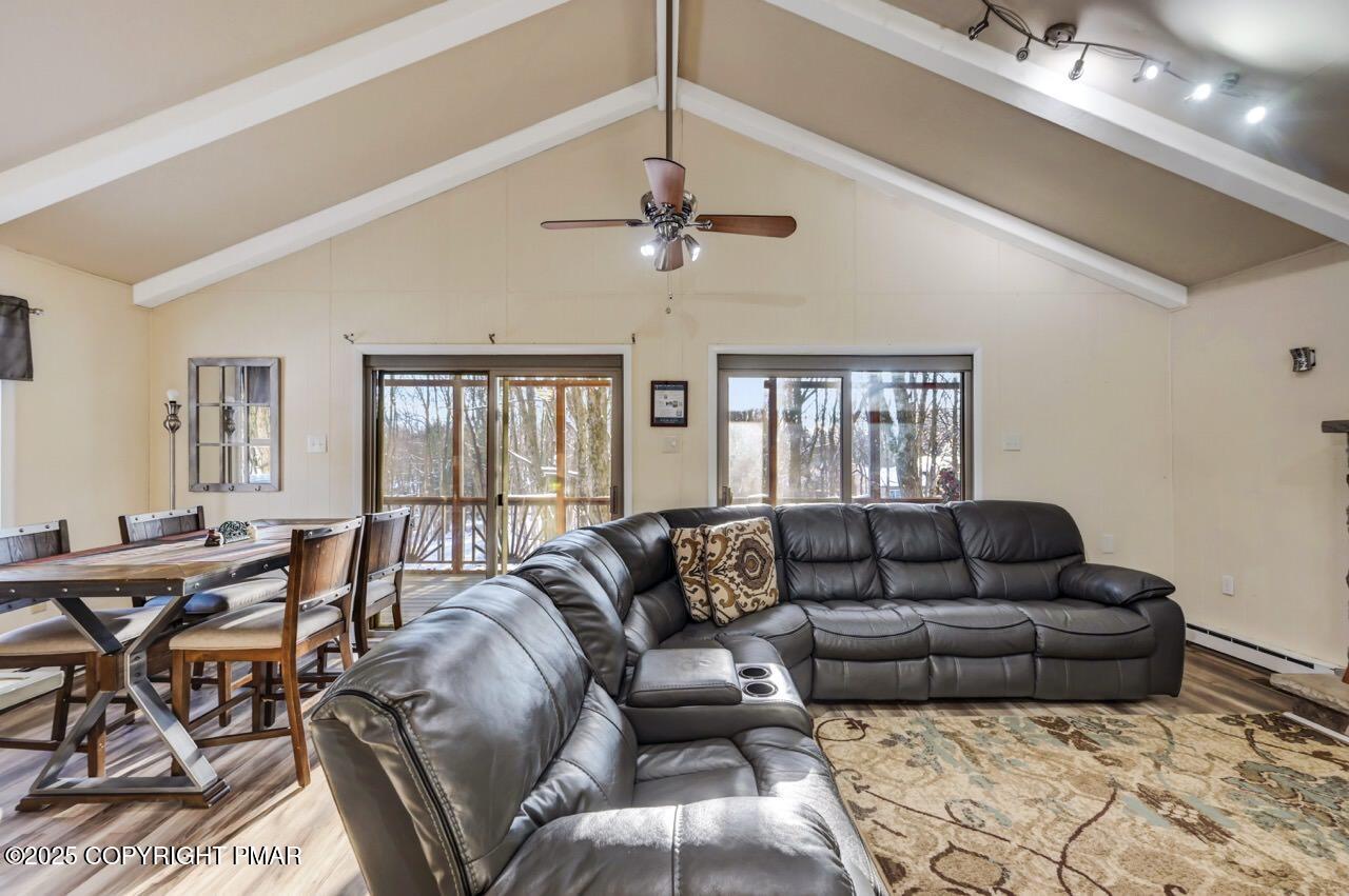 124 Fern Ridge Road Blakeslee, PA 18610 - Photo 10 of 69 a living room with furniture and a chandelier