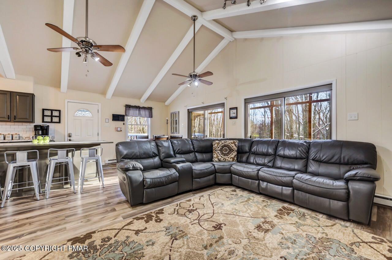 124 Fern Ridge Road Blakeslee, PA 18610 - Photo 11 of 69 a living room with furniture and a wooden floor