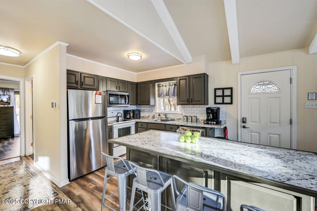 124 Fern Ridge Road Blakeslee, PA 18610 - Photo 14 of 69 a kitchen with stainless steel appliances granite countertop a refrigerator and a sink