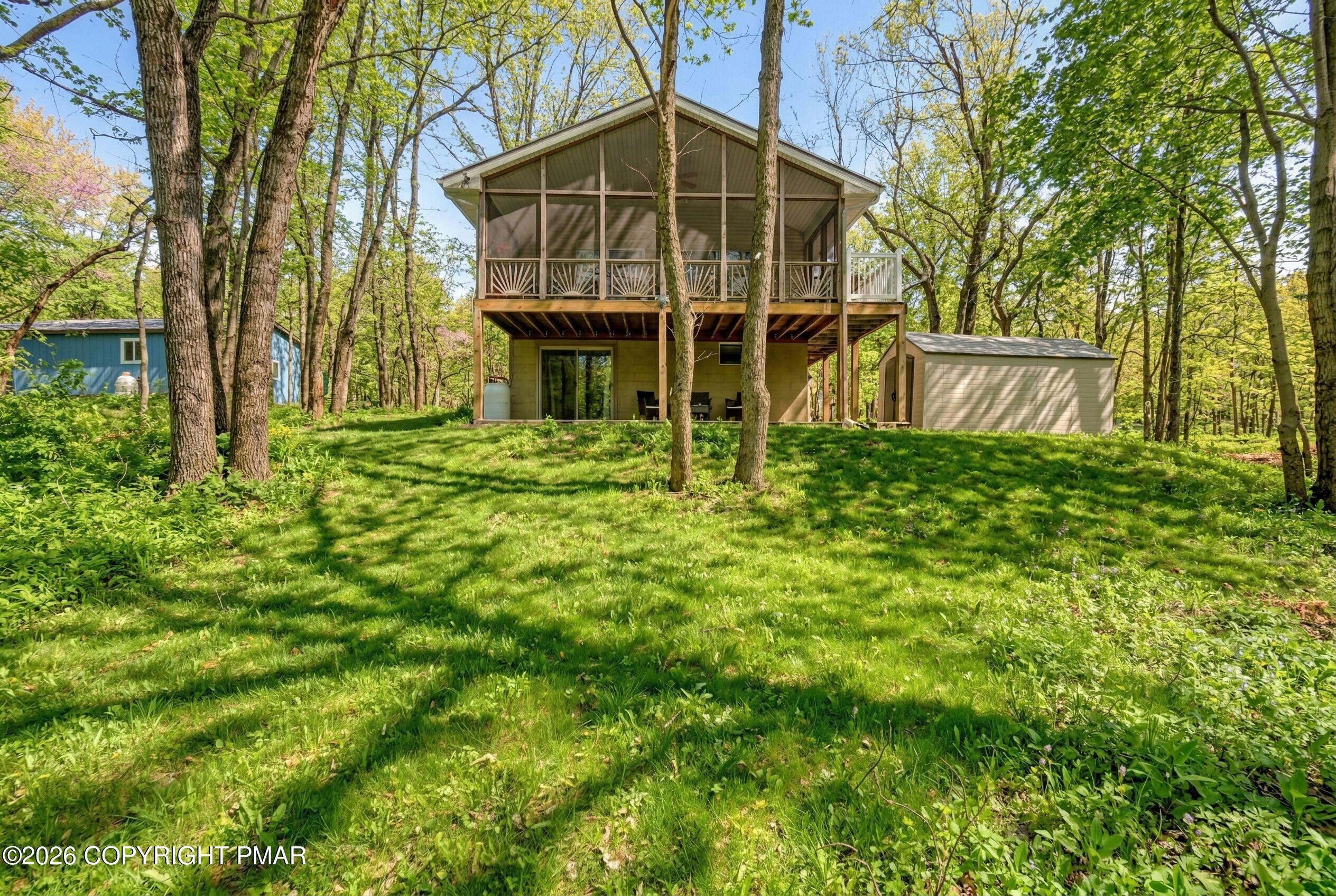 124 Fern Ridge Road Blakeslee, PA 18610 - Photo 2 of 69 a view of front of house with a yard