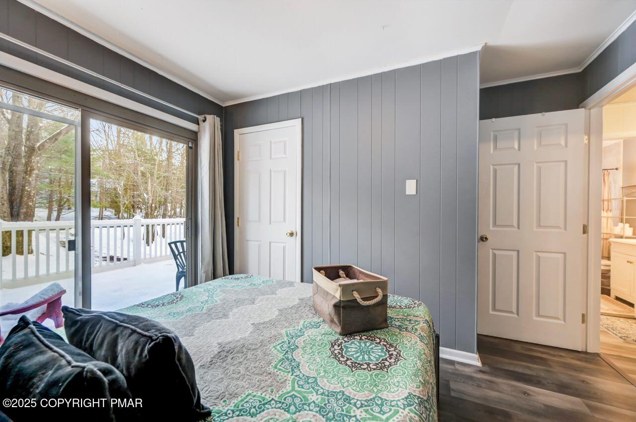 124 Fern Ridge Road Blakeslee, PA 18610 - Photo 28 of 69 a bedroom with a bed and wooden floor