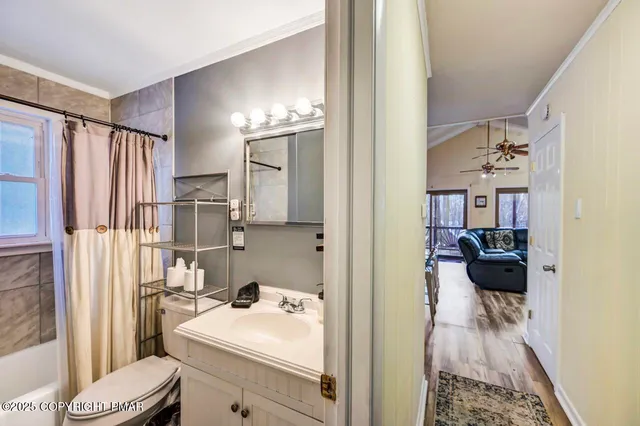 a bedroom with furniture and a flat screen tv