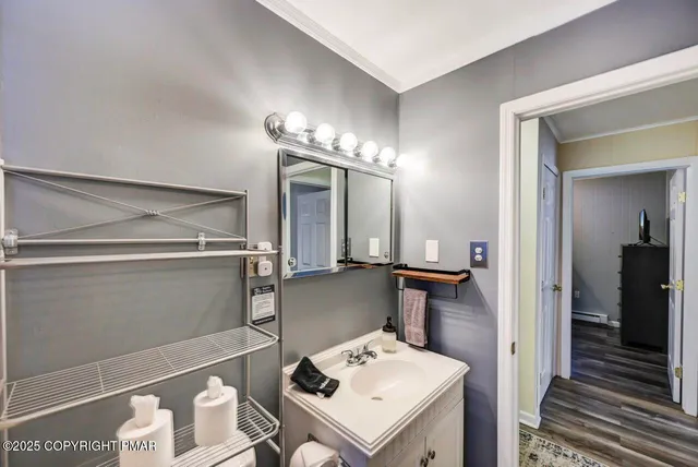 a view of a livingroom with furniture and staircase