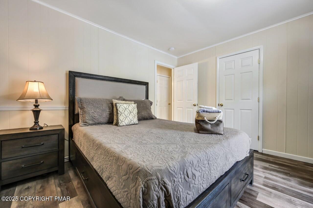 124 Fern Ridge Road Blakeslee, PA 18610 - Photo 34 of 69 a bedroom with a bed and a night stand