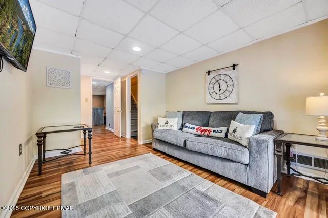 a view of a house with a yard and sitting area
