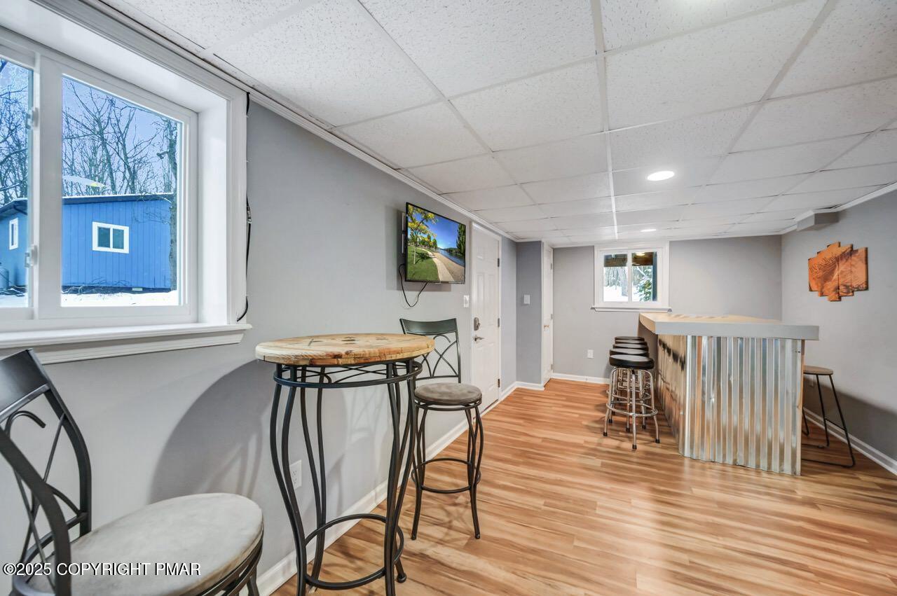 124 Fern Ridge Road Blakeslee, PA 18610 - Photo 45 of 69 a view of a dining room with furniture window and wooden floor