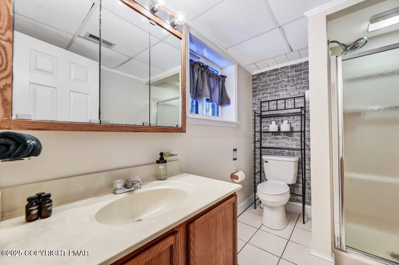 124 Fern Ridge Road Blakeslee, PA 18610 - Photo 53 of 69 a bathroom with a sink toilet and shower