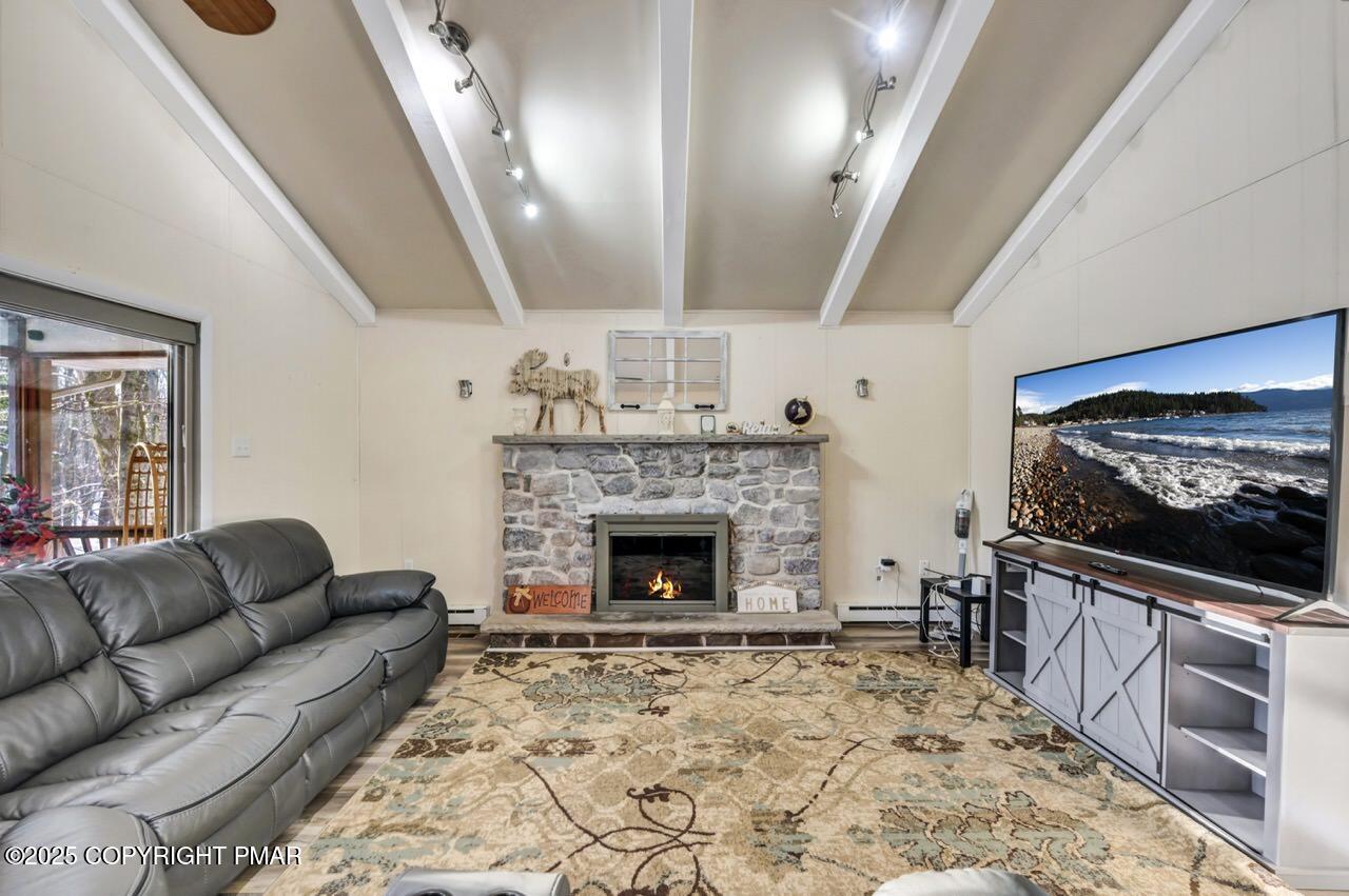 124 Fern Ridge Road Blakeslee, PA 18610 - Photo 7 of 69 a living room with furniture and a flat screen tv