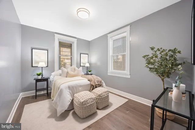 a bedroom with bed and a window