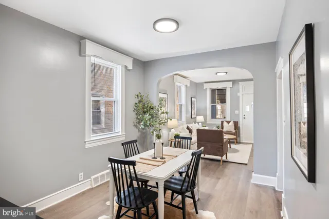 a view of a dining room with furniture and a window