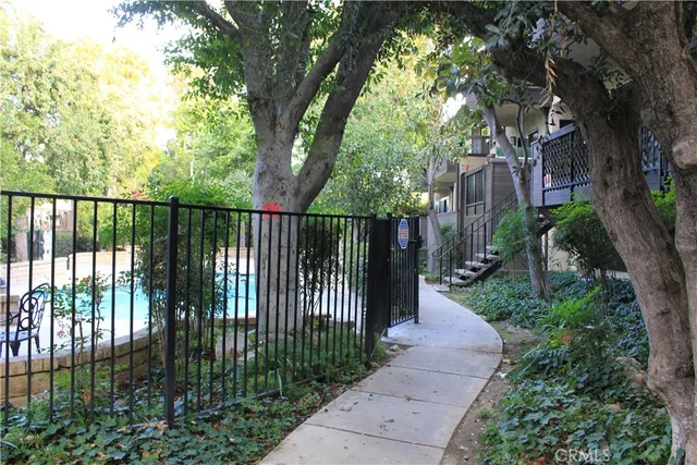 a view of a wrought iron fences in front of house