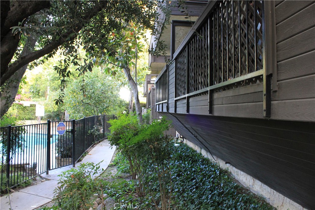 7304 Corbin Avenue, Unit F Reseda, CA 91335 - Photo 4 of 12 a view of a house with a street