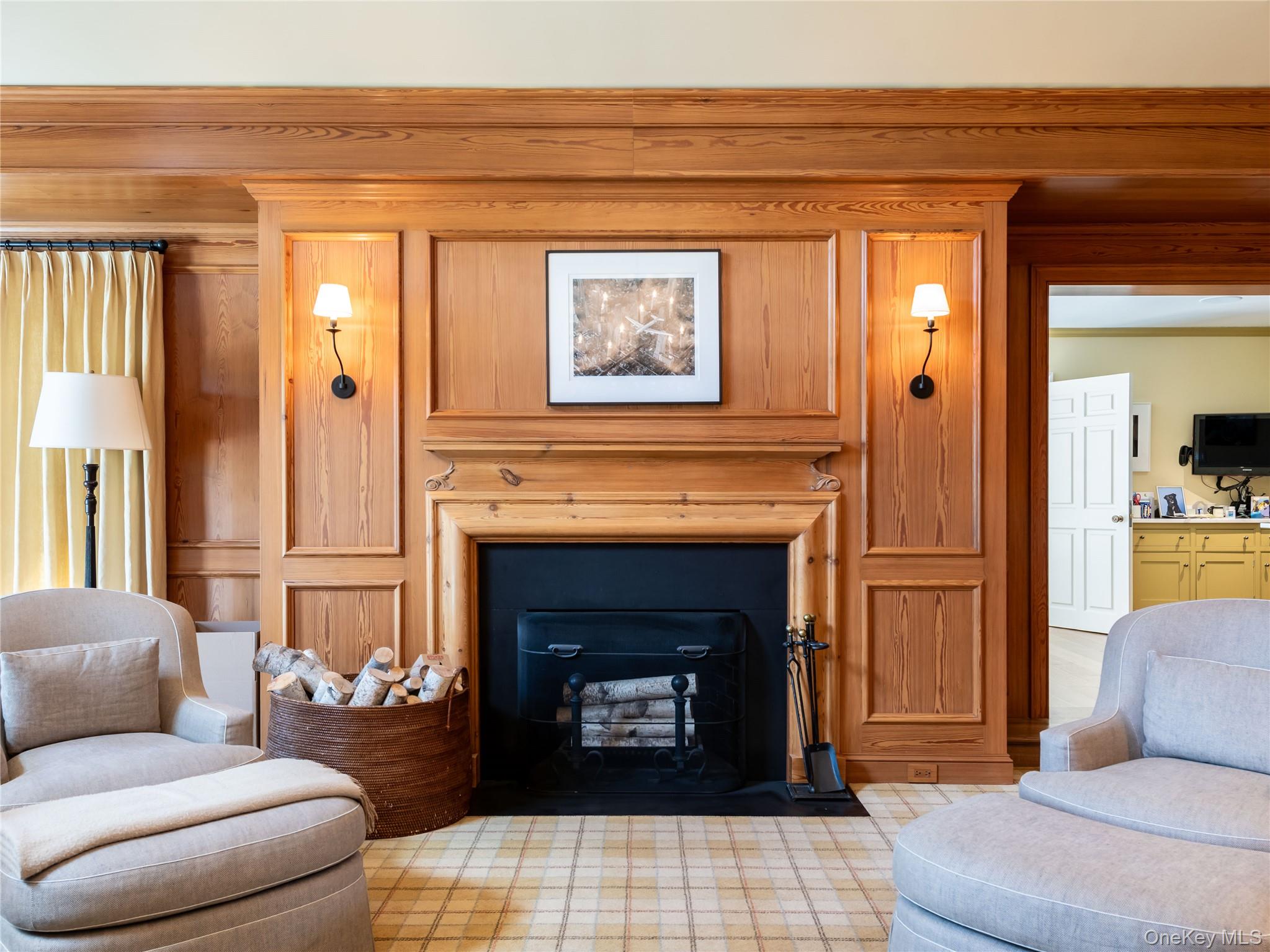 90 Elderfields Road Manhasset, NY 11030 - Photo 16 of 35 a living room with furniture and a fireplace
