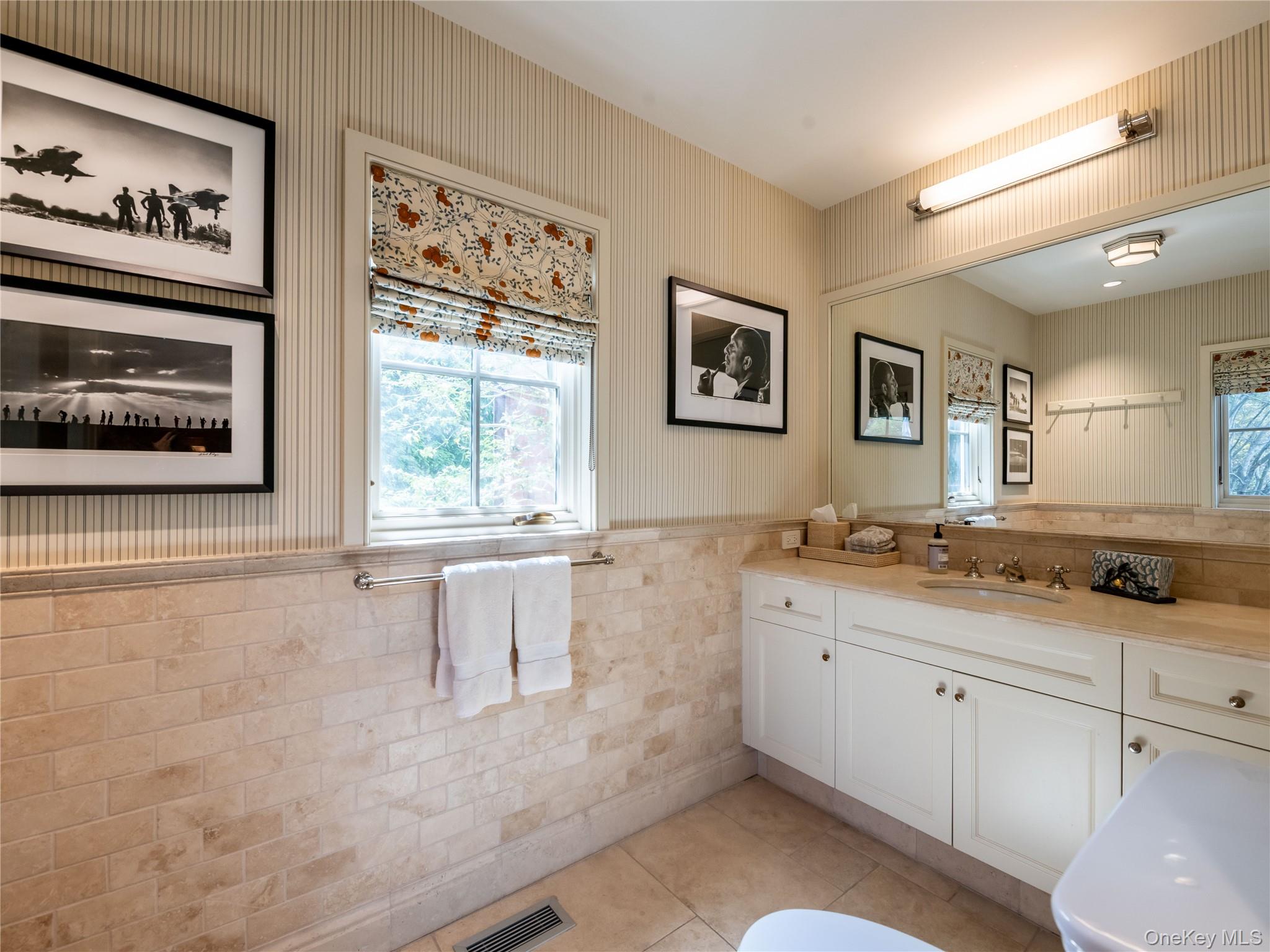 90 Elderfields Road Manhasset, NY 11030 - Photo 22 of 35 a bathroom with a granite countertop sink mirror and window