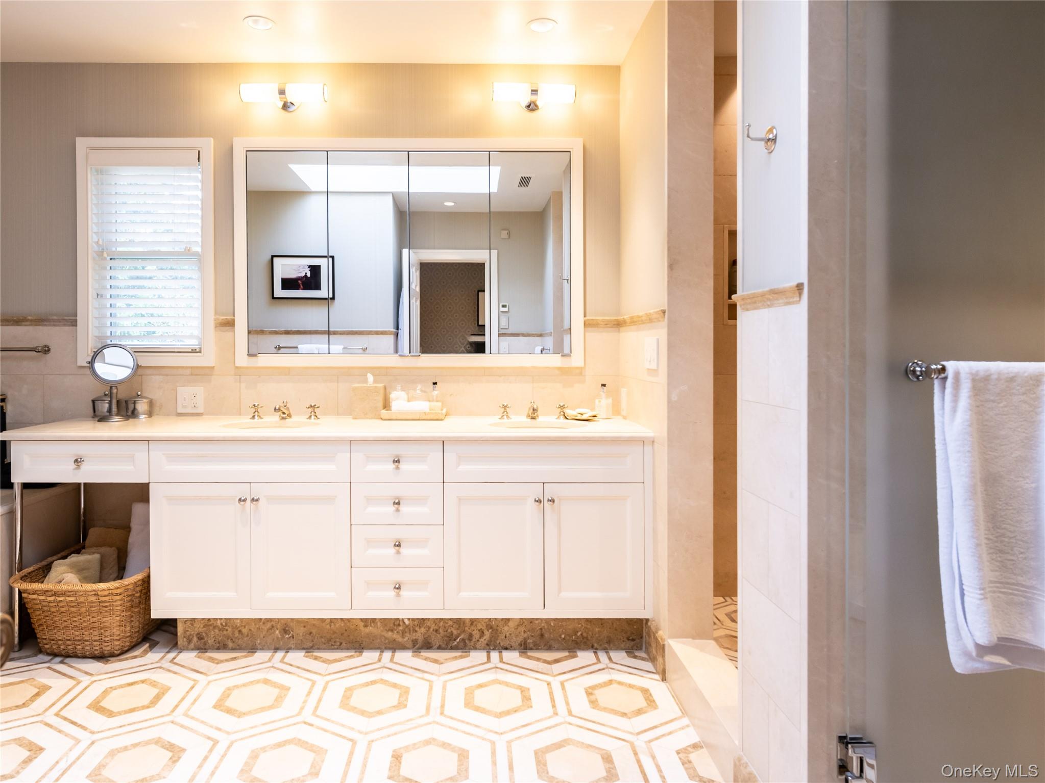 90 Elderfields Road Manhasset, NY 11030 - Photo 29 of 35 a bathroom with a sink and a mirror