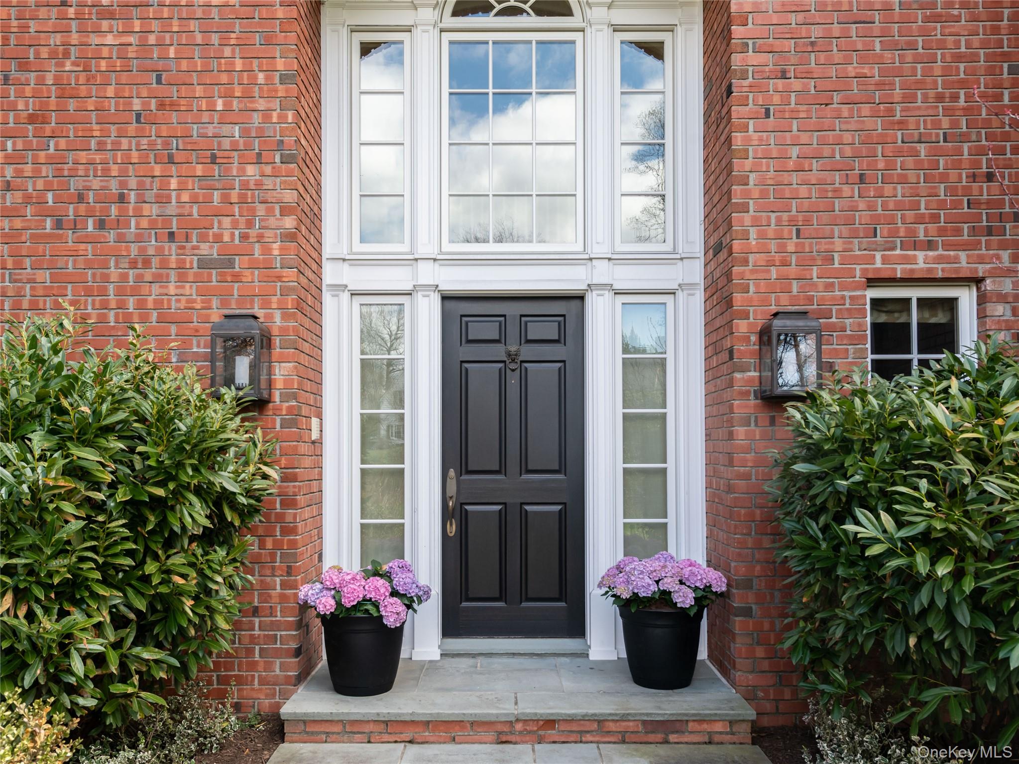 90 Elderfields Road Manhasset, NY 11030 - Photo 3 of 35 a flower plants in front of a building