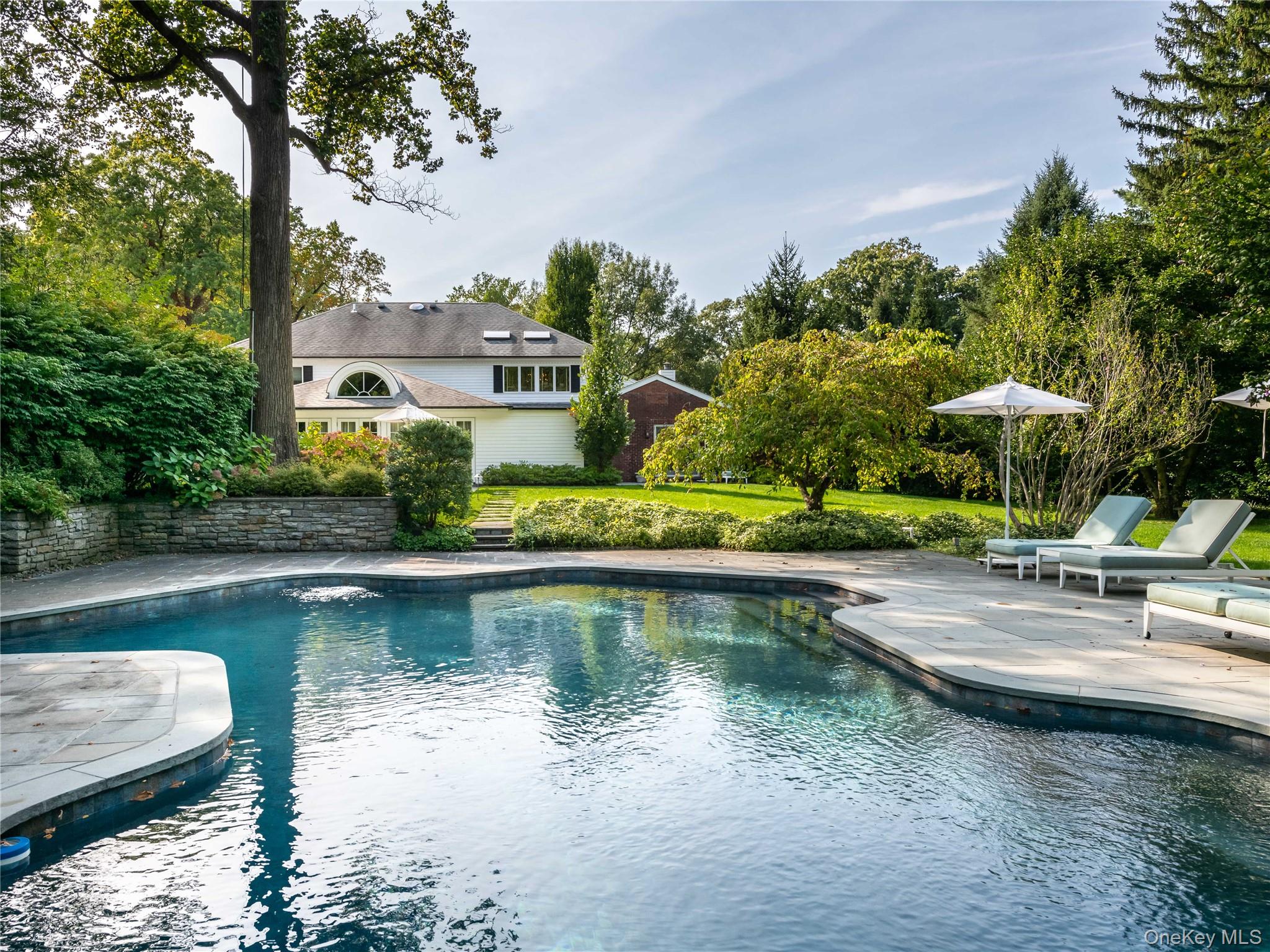 90 Elderfields Road Manhasset, NY 11030 - Photo 34 of 35 a view of a lake with a house