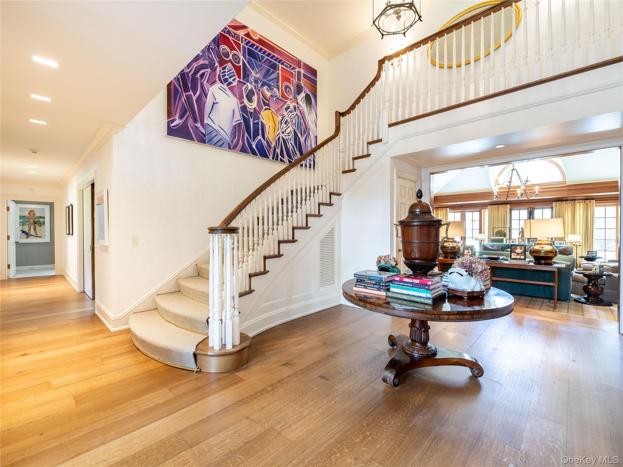 90 Elderfields Road Manhasset, NY 11030 - Photo 4 of 35 a view of a livingroom with furniture and a floor to ceiling window