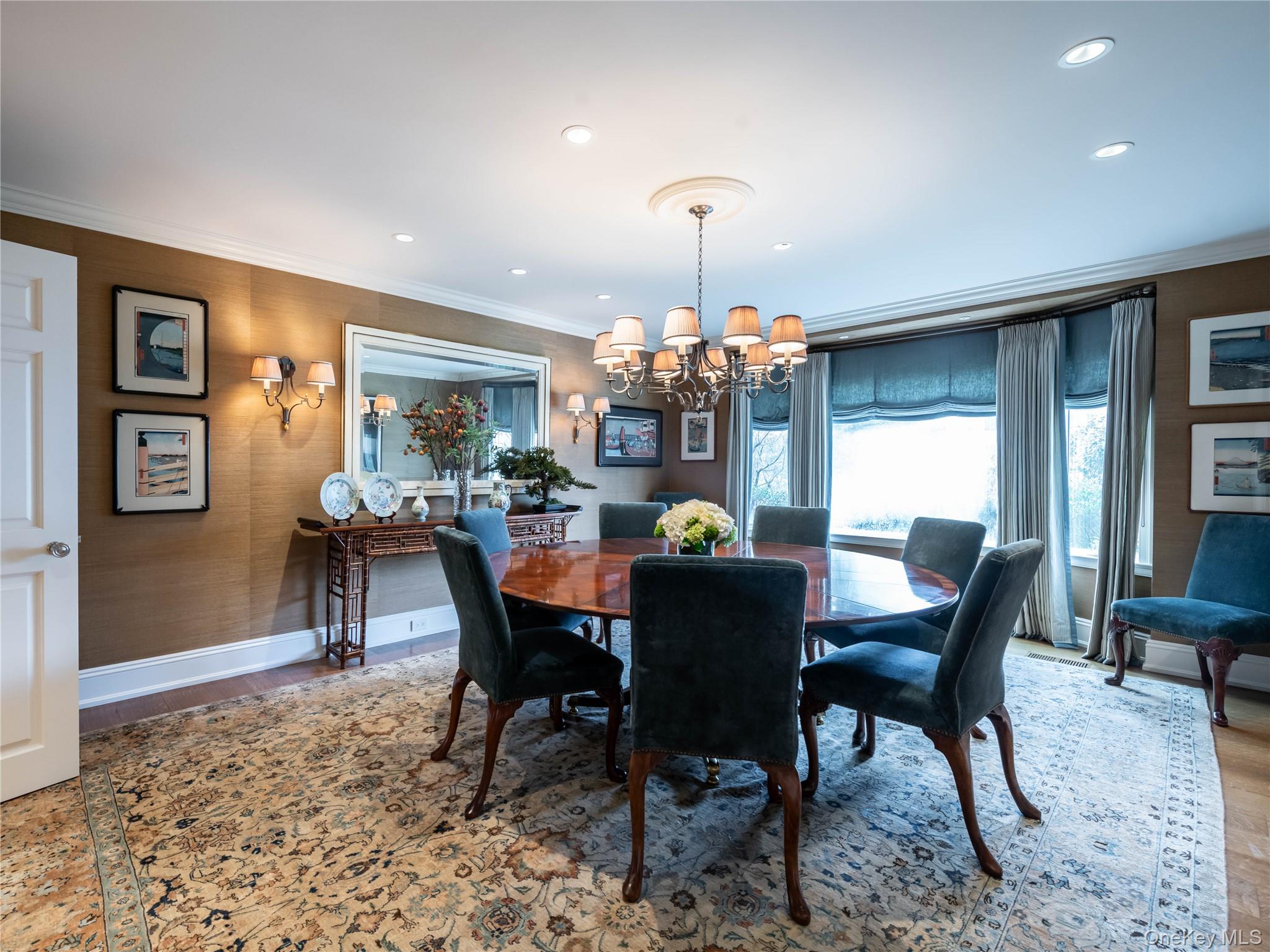 90 Elderfields Road Manhasset, NY 11030 - Photo 9 of 35 a view of a dining room with furniture and chandelier