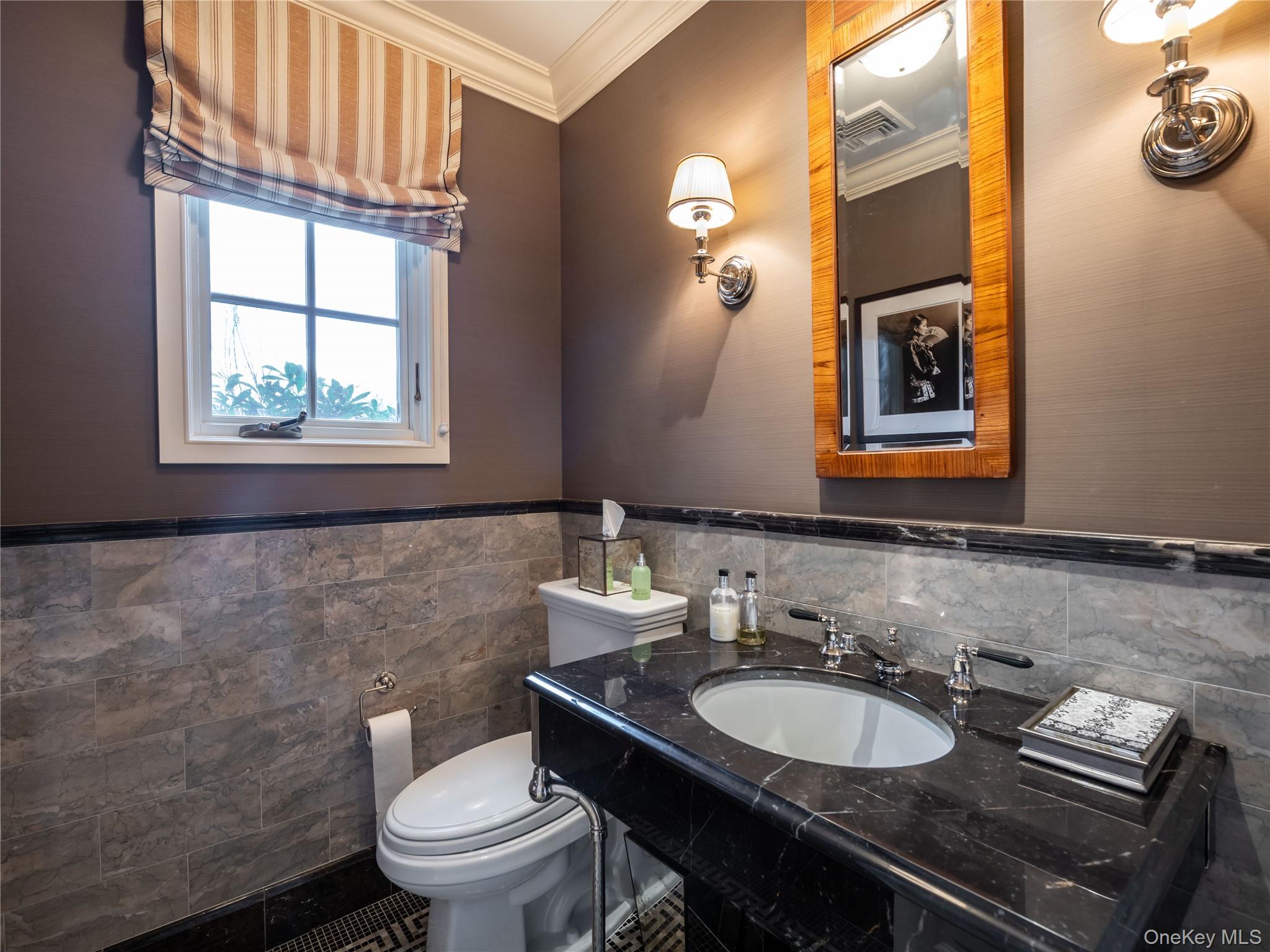 90 Elderfields Road Manhasset, NY 11030 - Photo 10 of 35 a bathroom with a toilet a sink and a mirror