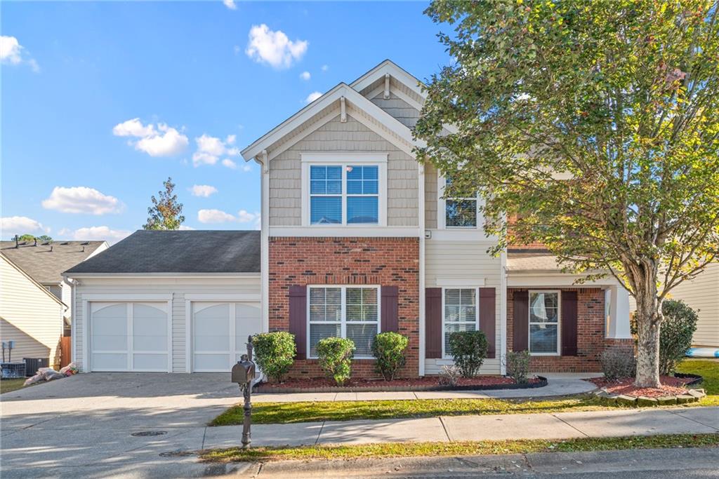 1205 Red Bud Lane Canton, GA 30114 - Photo 1 of 1 a front view of a house with swimming pool and yard