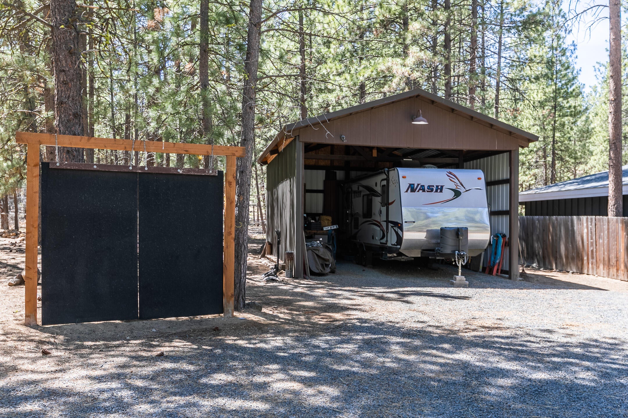 19175 Kiowa Road Bend, OR 97702 - Photo 29 of 44 Pole barn/RV barn with power and lights.