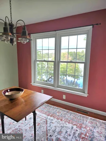a view of a room that has a bed and a window
