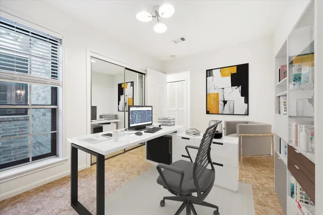 a room with furniture a desk and chair