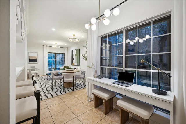 a view of a dining room with furniture window and outside view