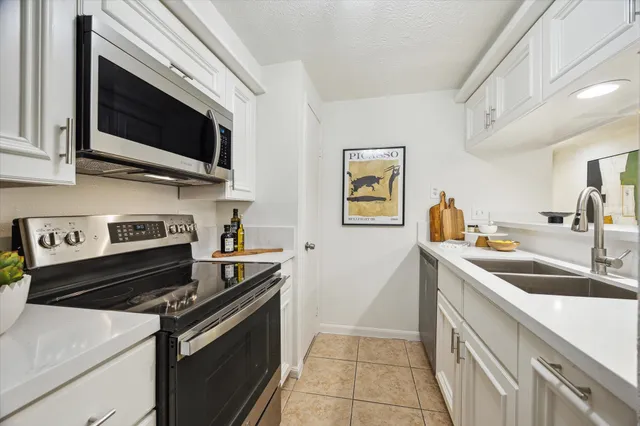 a living room with furniture a rug and a window