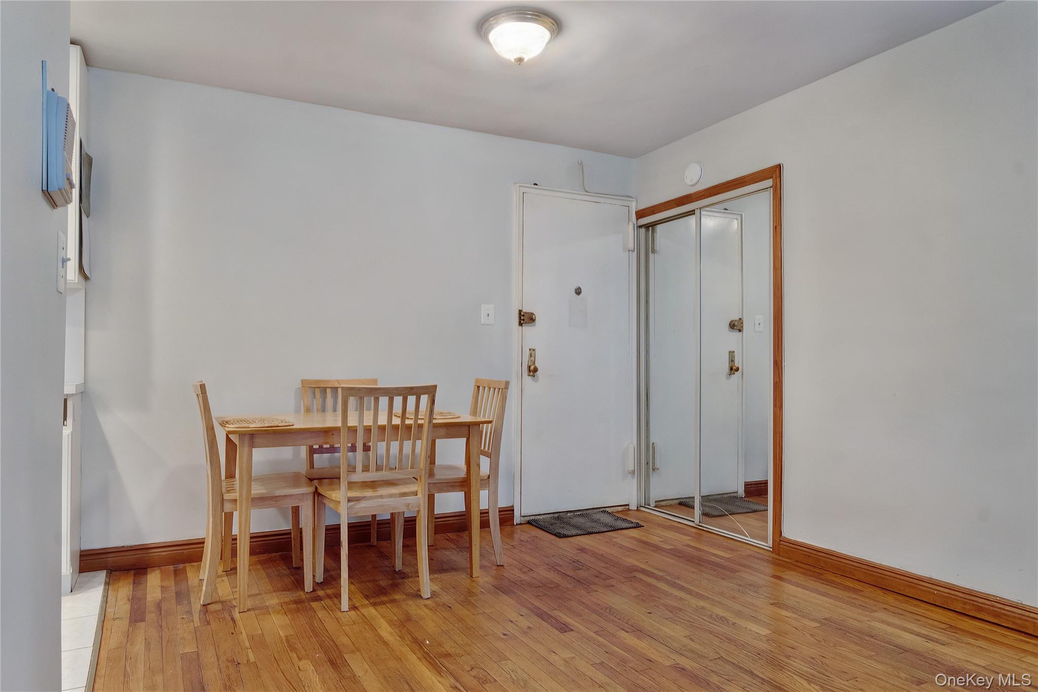 133 Beach 120th Street, Unit 2C Queens, NY 11694 - Photo 11 of 13 a view of a livingroom with furniture and wooden floor