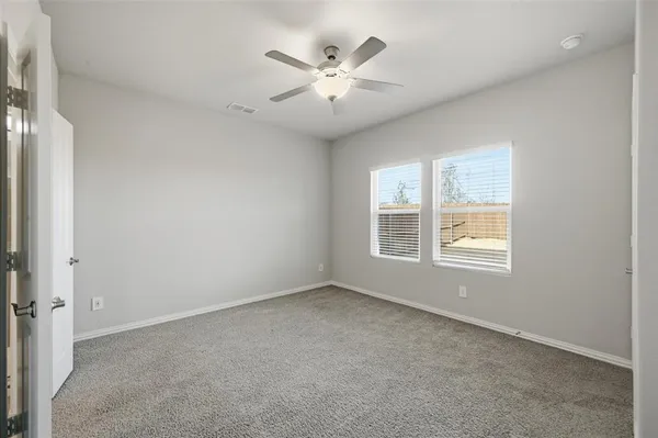 a spacious bathroom with a double vanity sink mirror and shower